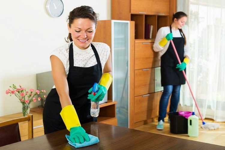 A man and women doing house cleaninmg service